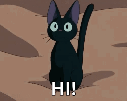 Five cats sit around a table. In the center of the table is a dish with food on it and a single candle. One cat is wearing a Hello Kitty hat. It looks like the cats are performing a seance.